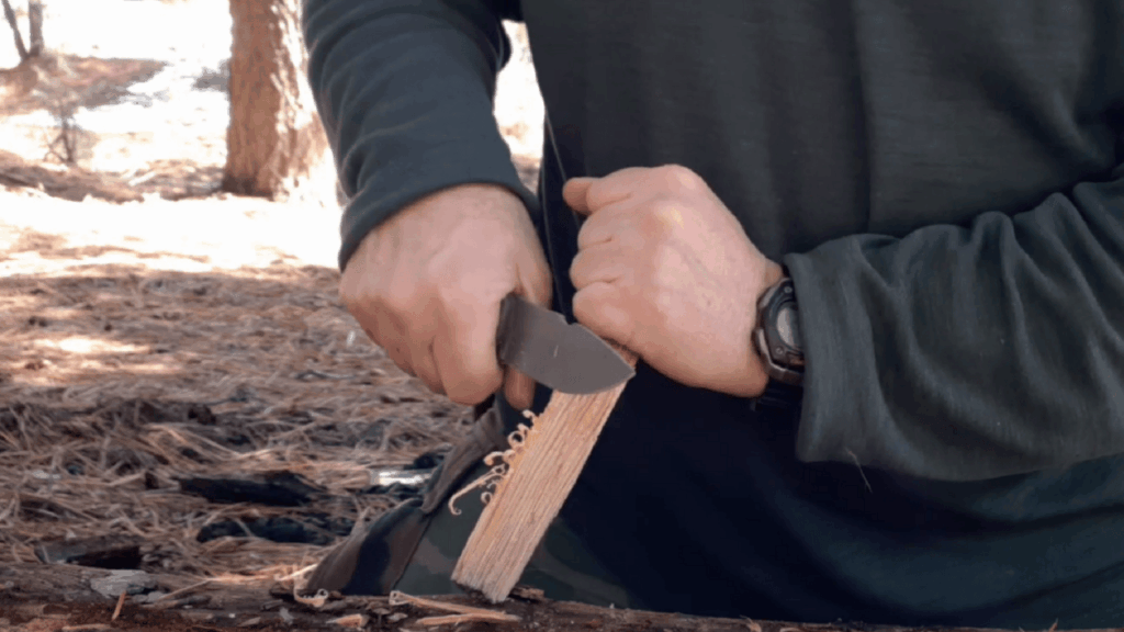 A man using a wood carving knife