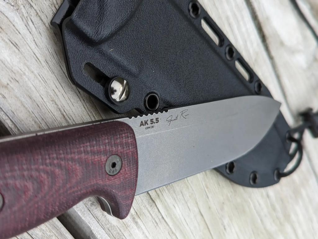 Knife resting on wooden table